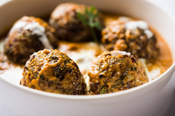 A bowl of flavorful Indian kofta served with creamy yogurt sauce