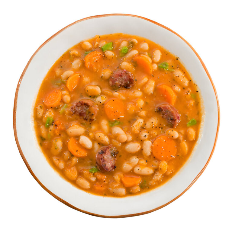 A bowl of hearty white bean soup with sausage and vegetables.