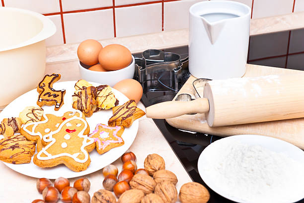 A cozy kitchen scene featuring a plate of decorated gingerbread cookies, eggs, and baking ingredients.