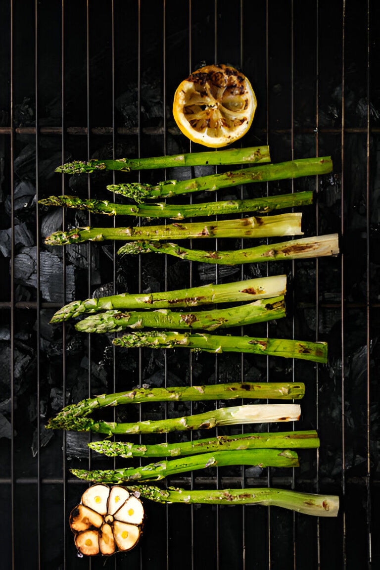 Grilled asparagus and lemon on a charcoal grill