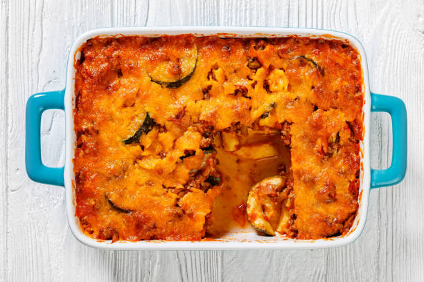 Baked casserole dish with golden-brown topping and visible vegetables